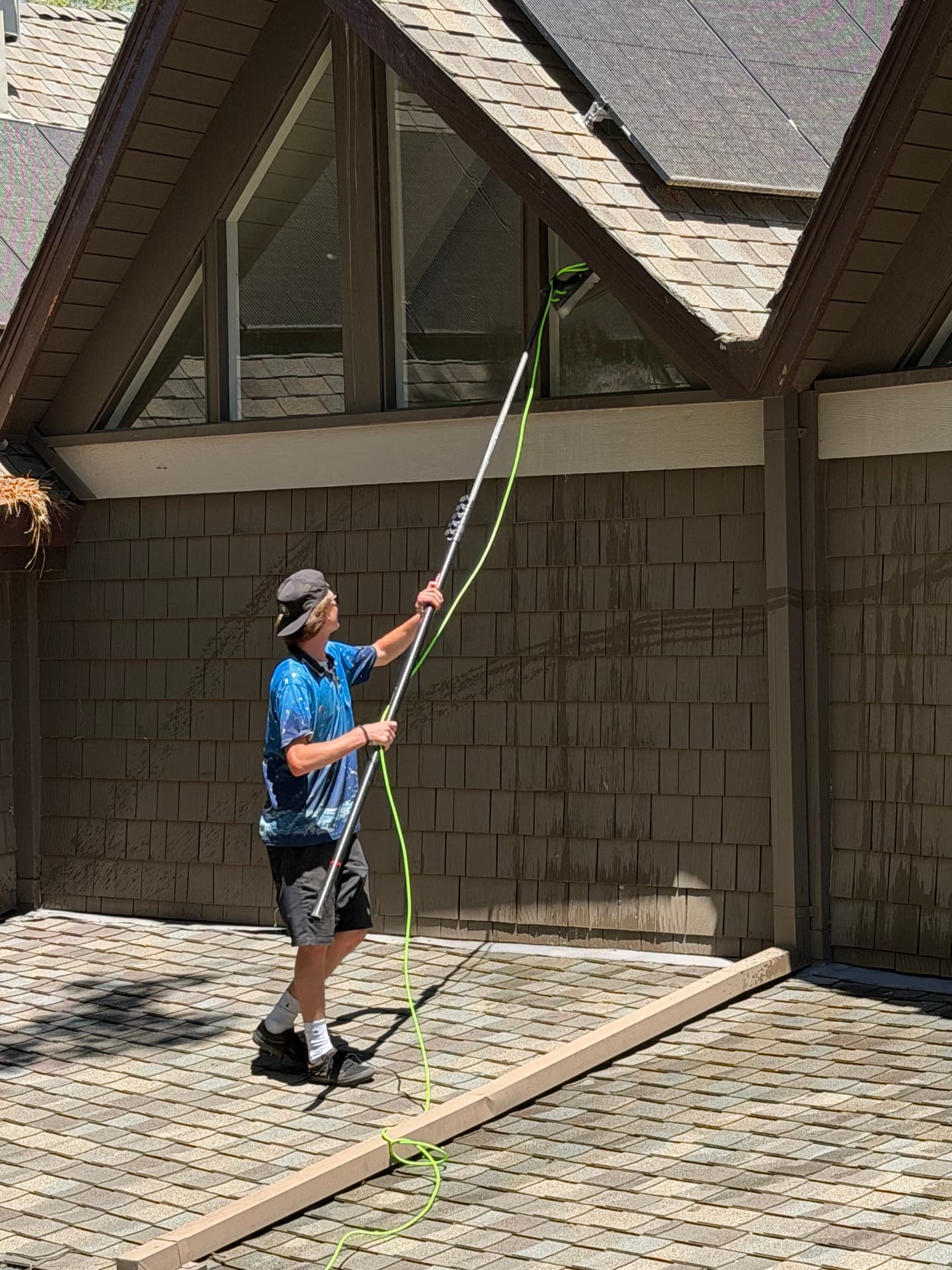Pine View cleaning windows with a pure water pole